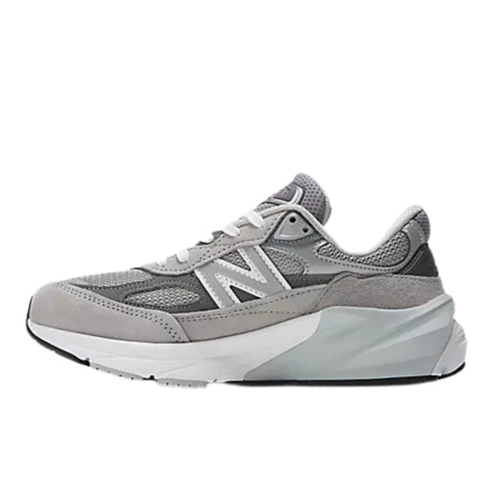 Grey athletic sneaker with mesh panels, white laces, and a thick sculpted sole, shown in side view