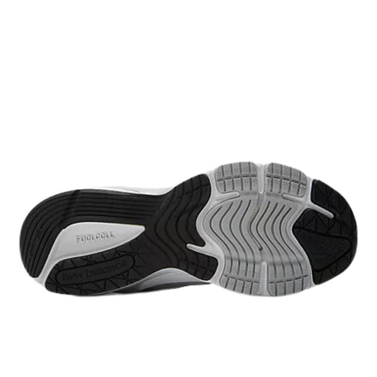 Black and gray athletic shoe outsole with wavy tread and embossed FuelCell marking