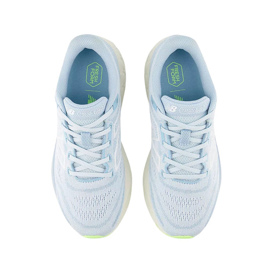Pair of light blue and white running shoes viewed from above with laces and mesh uppers