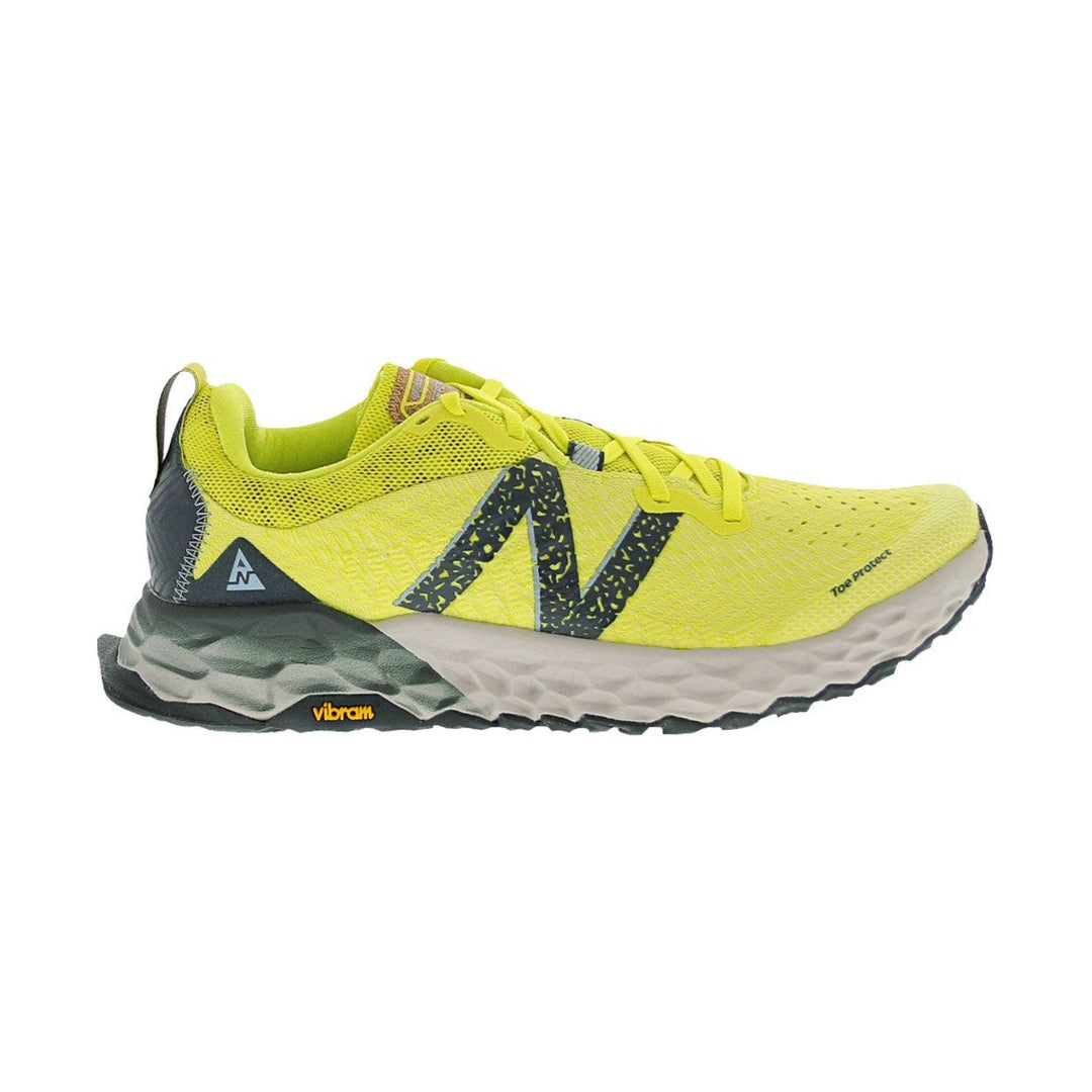 Bright yellow trail running shoe with black side logo, textured midsole, and toe protect marking