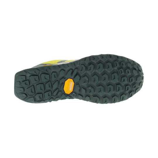 Trail running shoe outsole with dark lugged tread and a yellow MEGAGRIP label