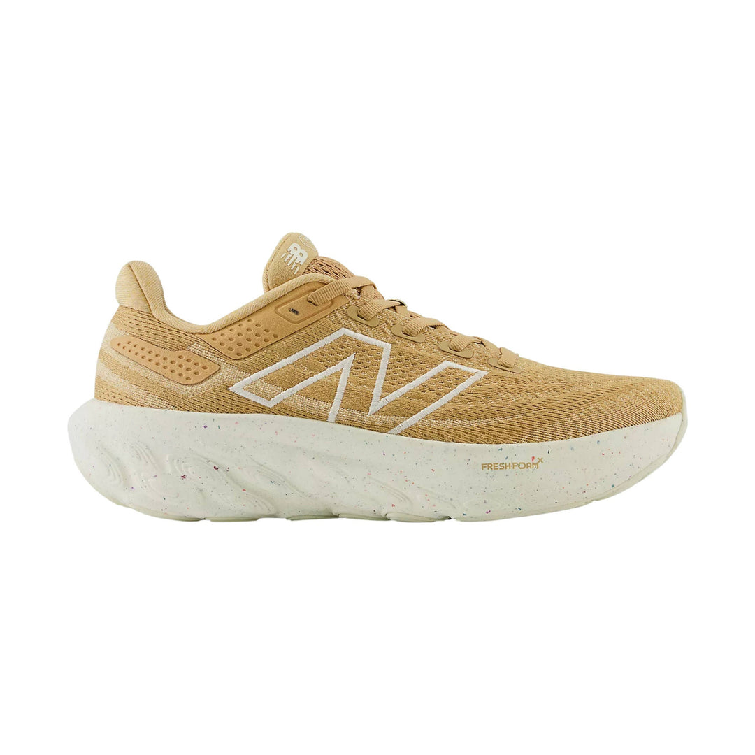 Tan running shoe with white foam midsole and large side logo