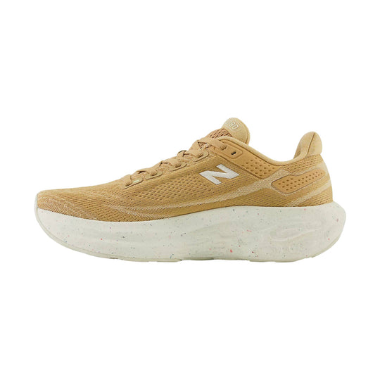 Tan running shoe with white speckled thick sole and side logo