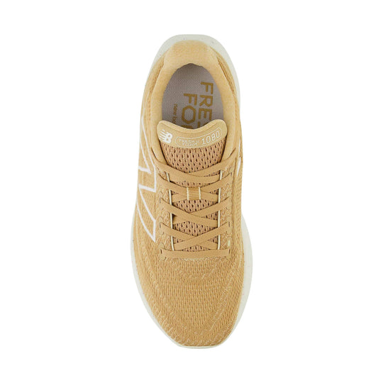 Tan running shoe viewed from above with mesh upper, laces, and visible Fresh Foam 1080 branding