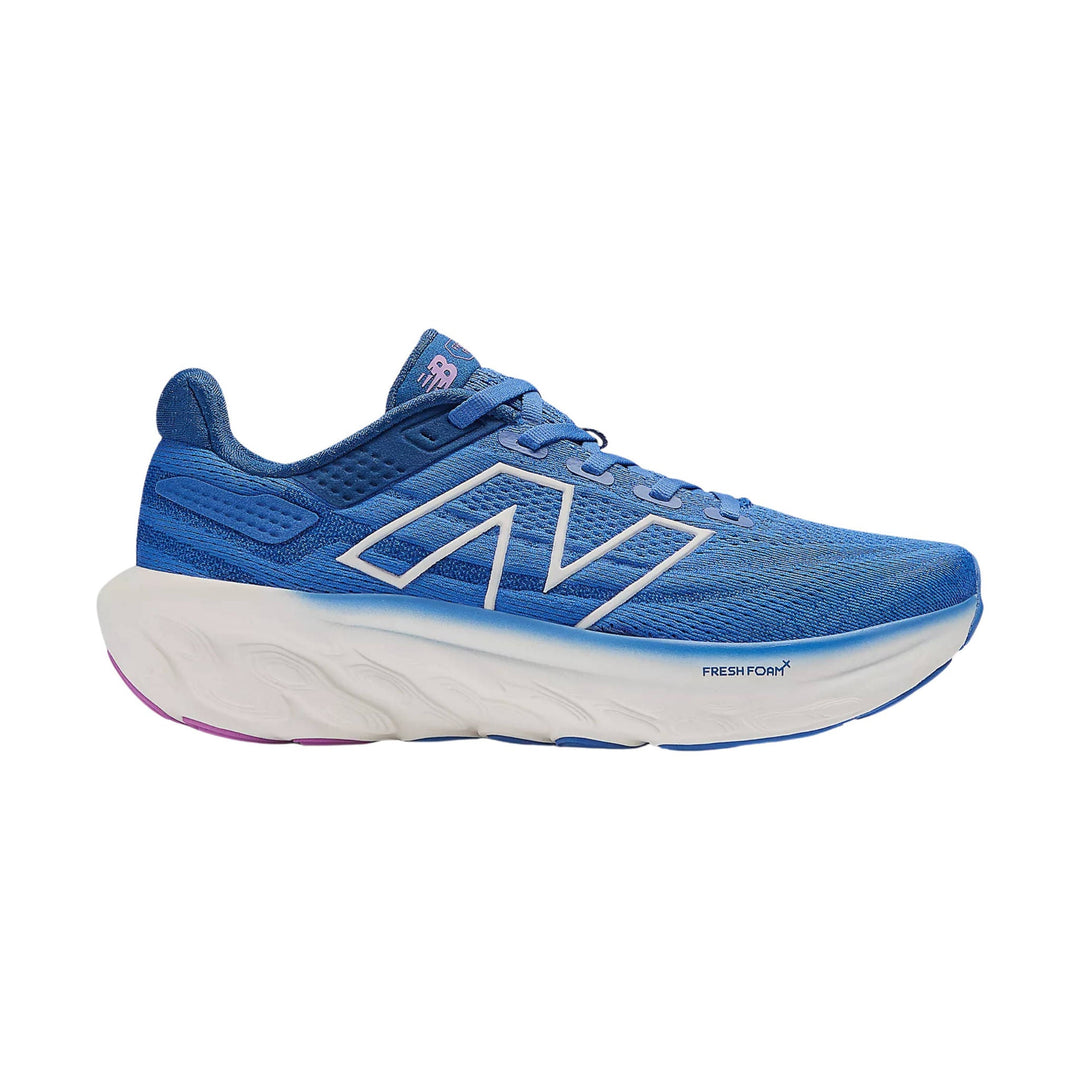 Blue running shoe with thick white foam sole and large side logo