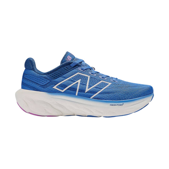 Blue running shoe with thick white foam sole and large side logo