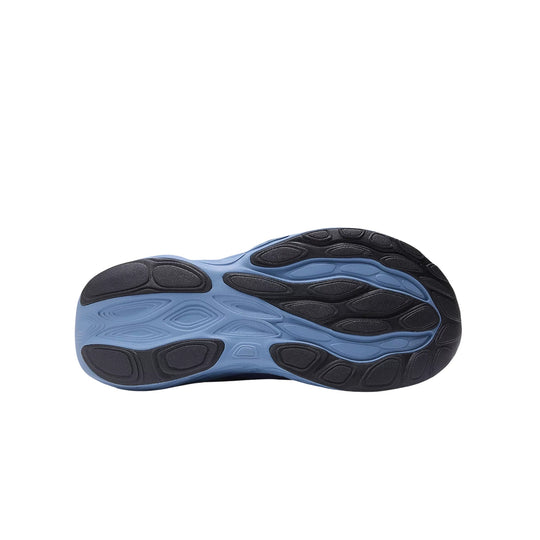 Blue and black running shoe outsole with cushioned traction pods