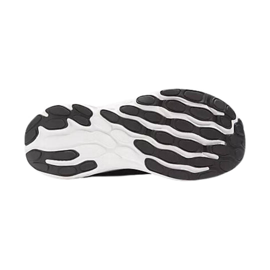 Black and white running shoe outsole with oval traction pods