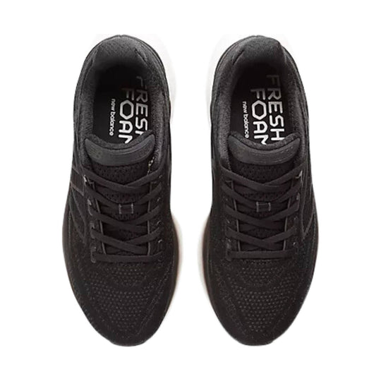 Pair of black running shoes shown from above with lace-up fronts and mesh uppers