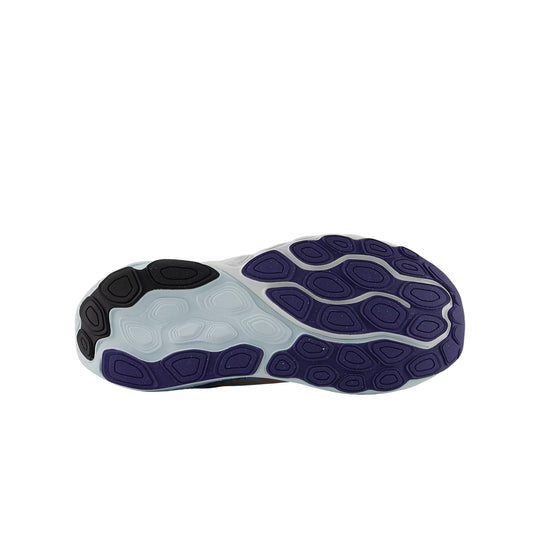 Running shoe outsole in purple, white, and black with multi-lug tread pattern