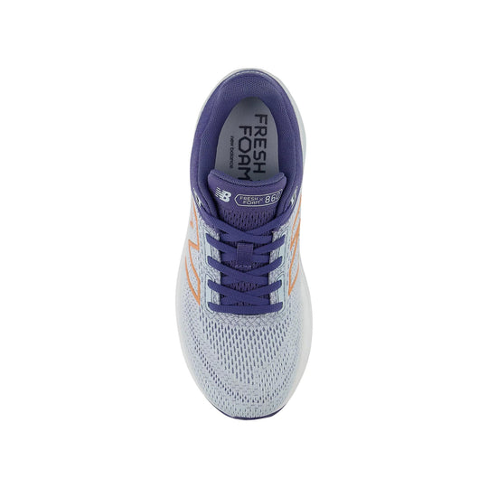 Purple and white running shoe with orange side accents, top view, showing Fresh Foam text on the tongue and insole.