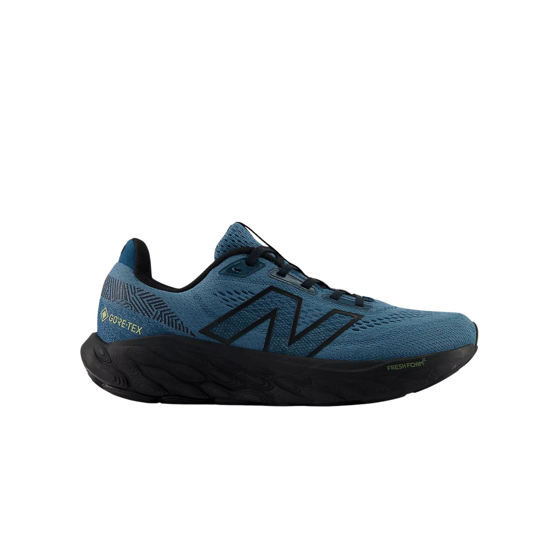 Blue and black running shoe with a thick black sole and visible GORE-TEX marking