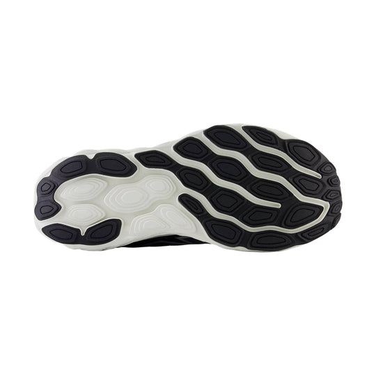 Black-and-white running shoe outsole with segmented rubber traction pods