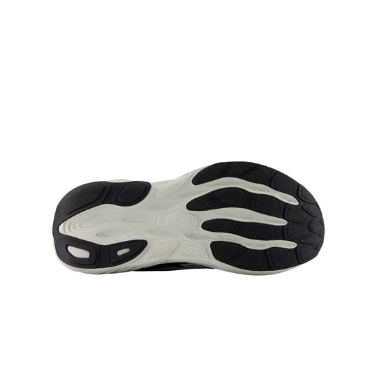 Black and white running shoe outsole with cushioned tread pods