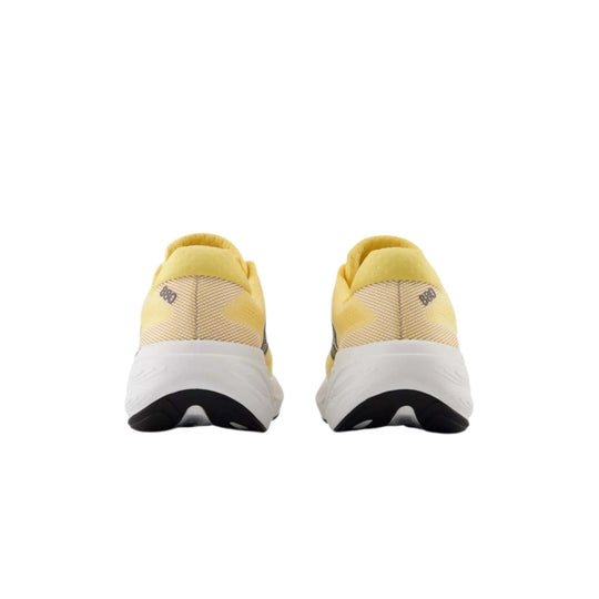Rear view of yellow running shoes with white midsoles and black outsoles
