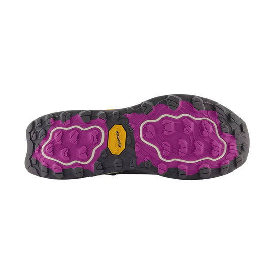 Black and magenta lugged hiking shoe outsole with a yellow MEGAGRIP label