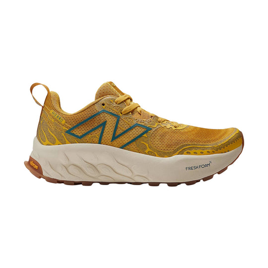 Golden trail running shoe with cream midsole and teal side logo