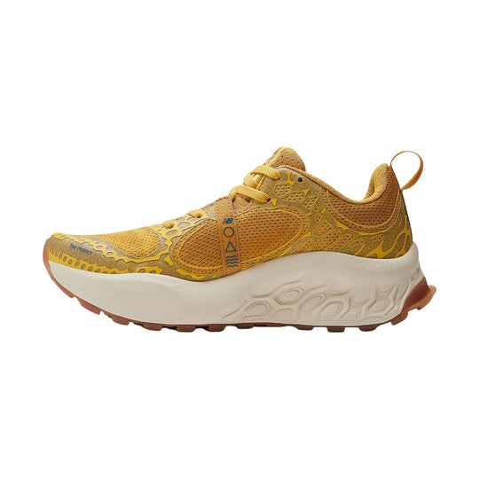 Golden yellow trail running shoe with thick white foam sole and brown outsole