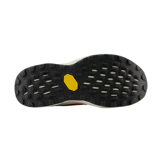 Black trail shoe outsole with yellow Vibram logo