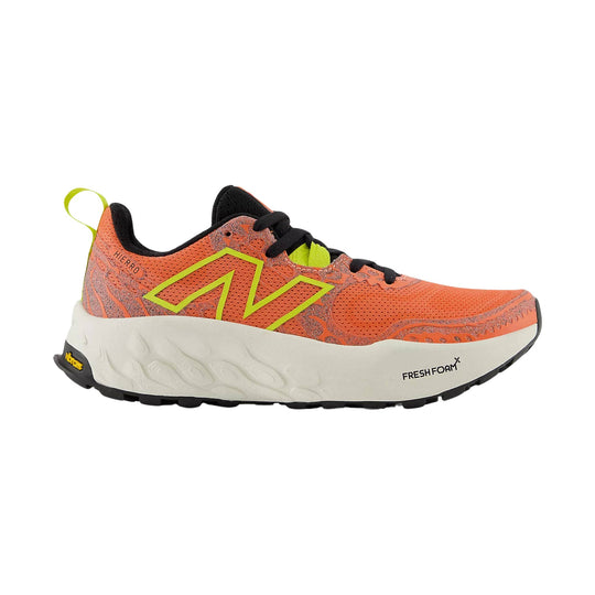 Orange and black trail running shoe with lime accents, thick white sole, and side logo