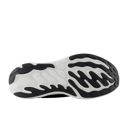 Black and white running shoe outsole with segmented rubber tread