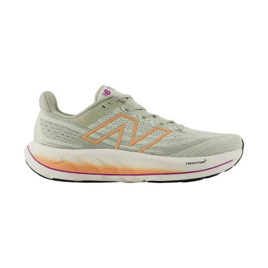 Light beige running shoe with peach side logo, knit upper, and Fresh Foam midsole