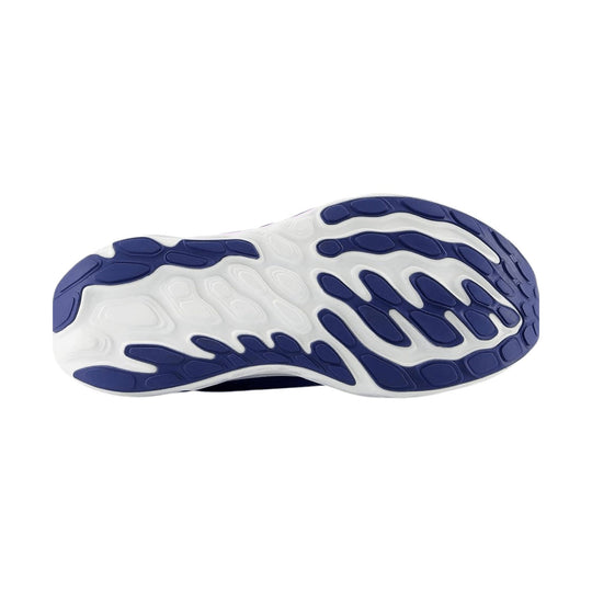 White running shoe outsole with navy blue rubber traction pods