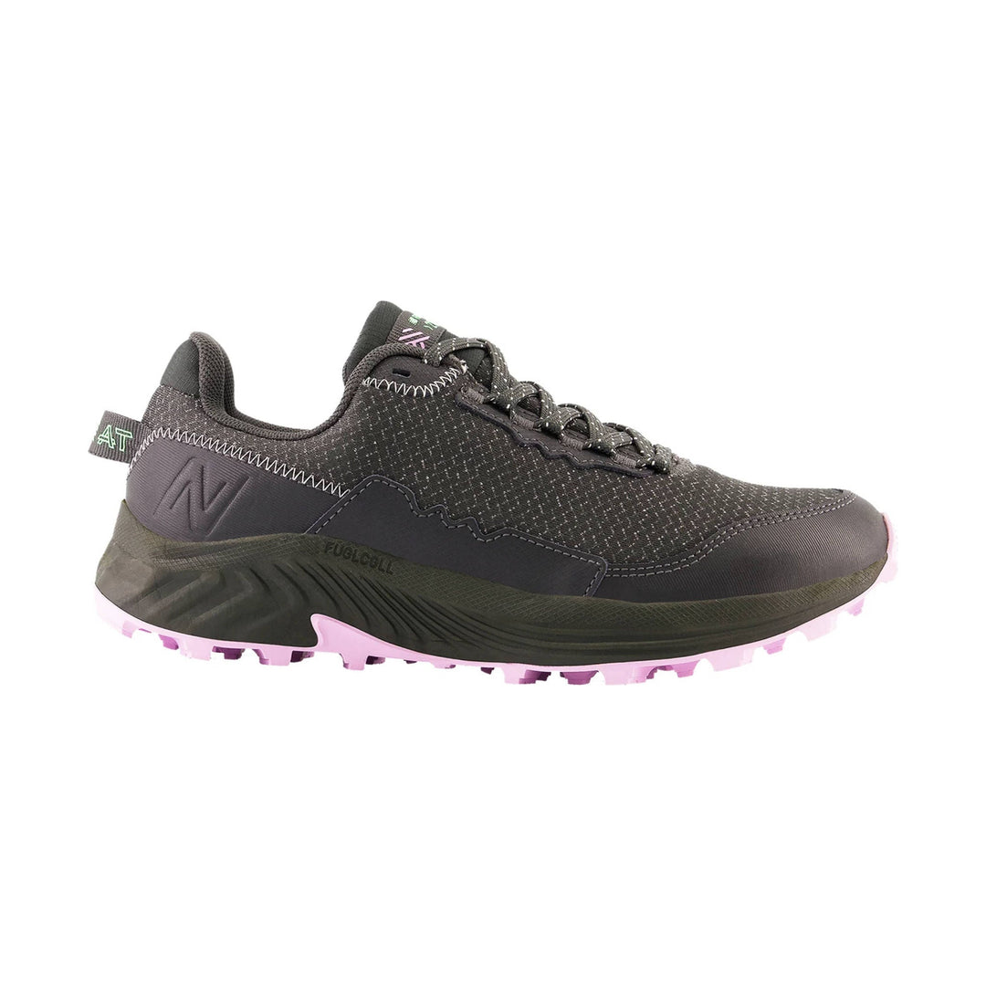 Black trail running shoe with knit upper, lace-up closure, and pink lugged outsole