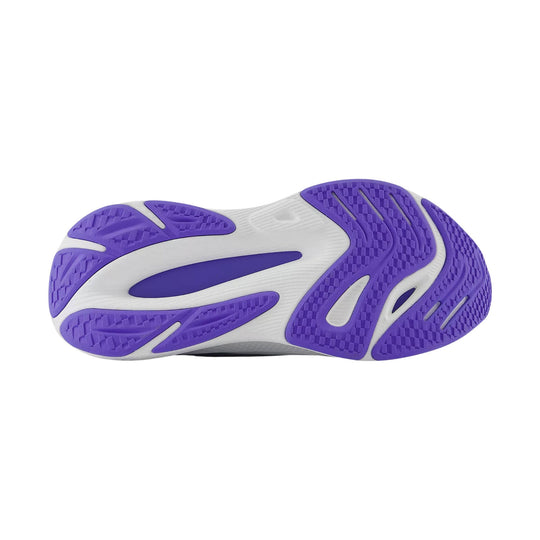White sneaker outsole with purple traction pods and textured tread pattern