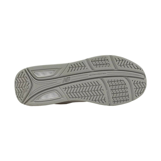 Gray shoe outsole with tread pattern and visible New Balance markings