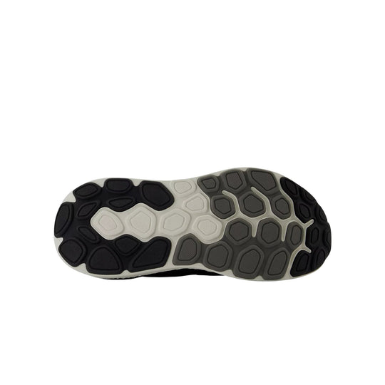 Black, gray, and white shoe outsole with segmented rubber tread