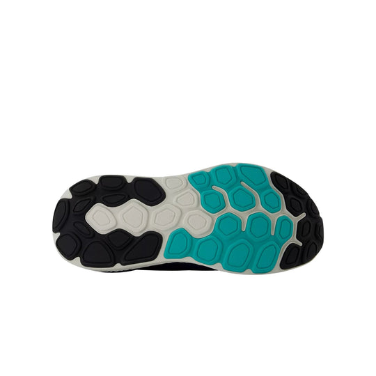 Running shoe outsole with black, white, and teal tread pods