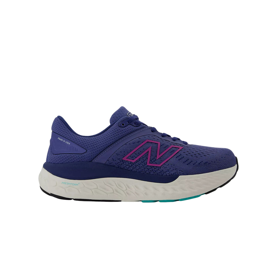 Purple running shoe with white cushioned sole and pink logo