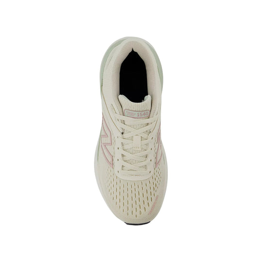 Cream running shoe with pink side accents and visible lacing, top view