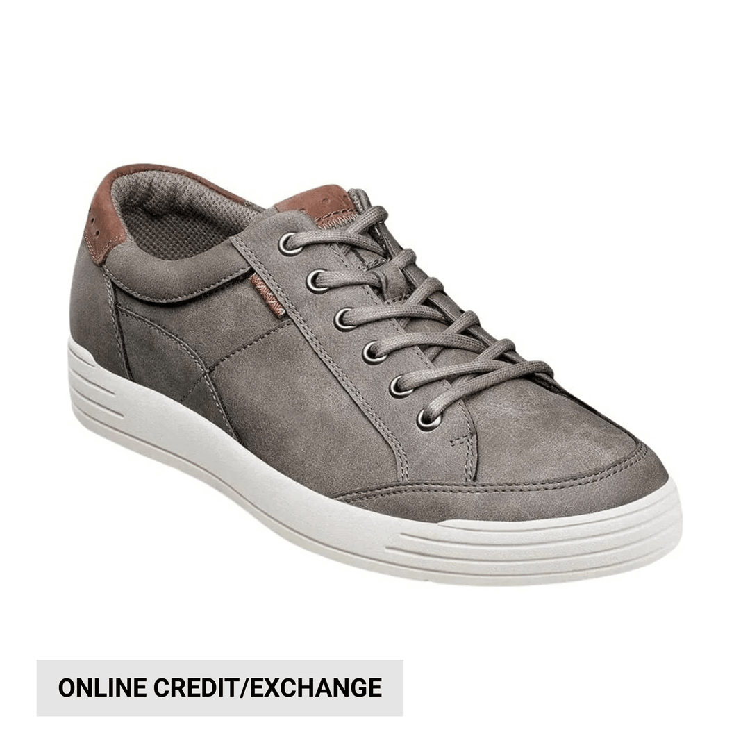 Gray lace-up sneaker with white sole and brown heel accent, shown in side view