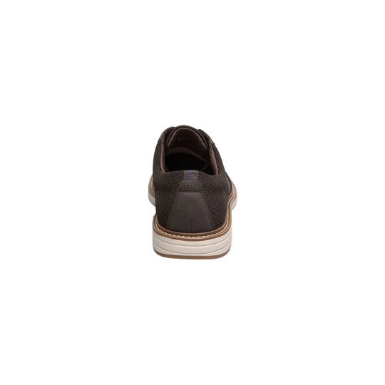 Rear view of a dark brown knit oxford shoe with a beige cushioned sole