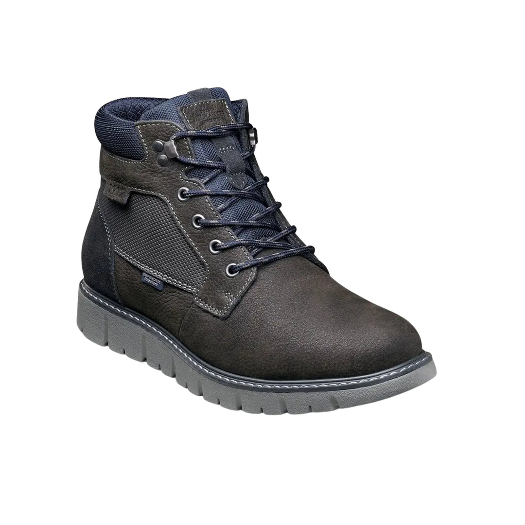 Dark lace-up ankle work boot with padded collar, textured side panels, and a gray lug sole