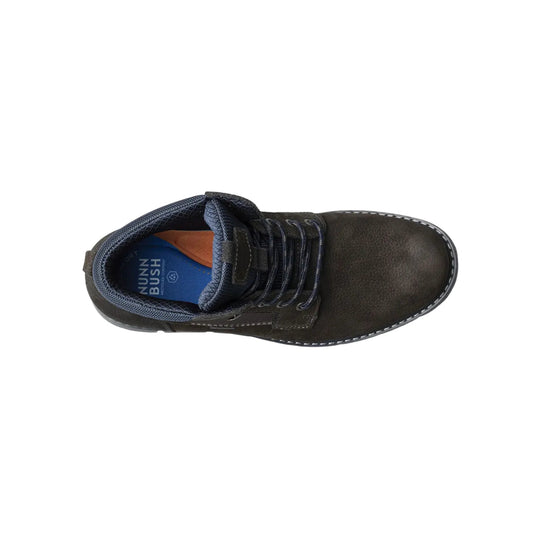Top view of a dark lace-up boot with a navy padded collar and blue insole labeled NUNN BUSH