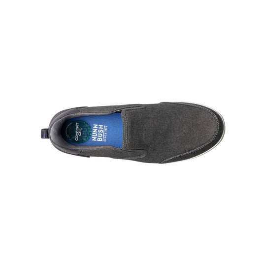 Gray canvas slip-on shoe with a black sole, viewed from above, showing blue insole branding