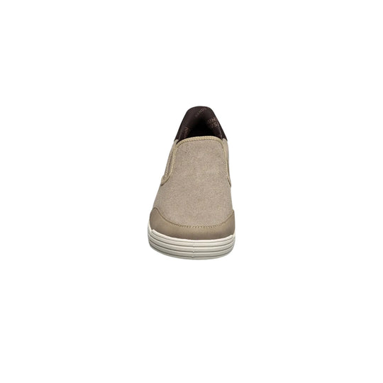 Beige canvas slip-on shoe shown from the front with a dark brown collar and white ridged sole.