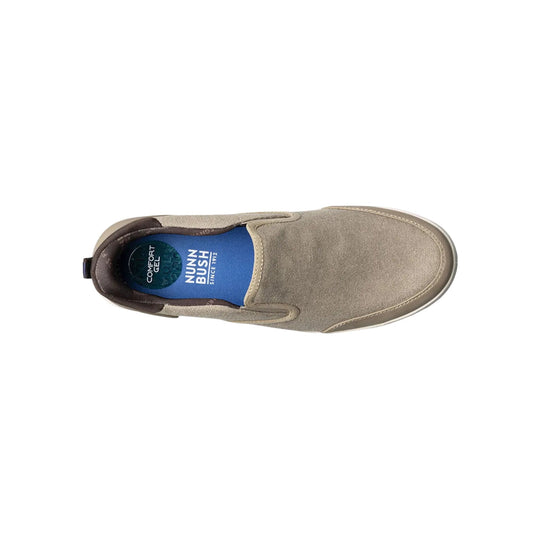 Beige canvas slip-on shoe with blue insole and visible brand text