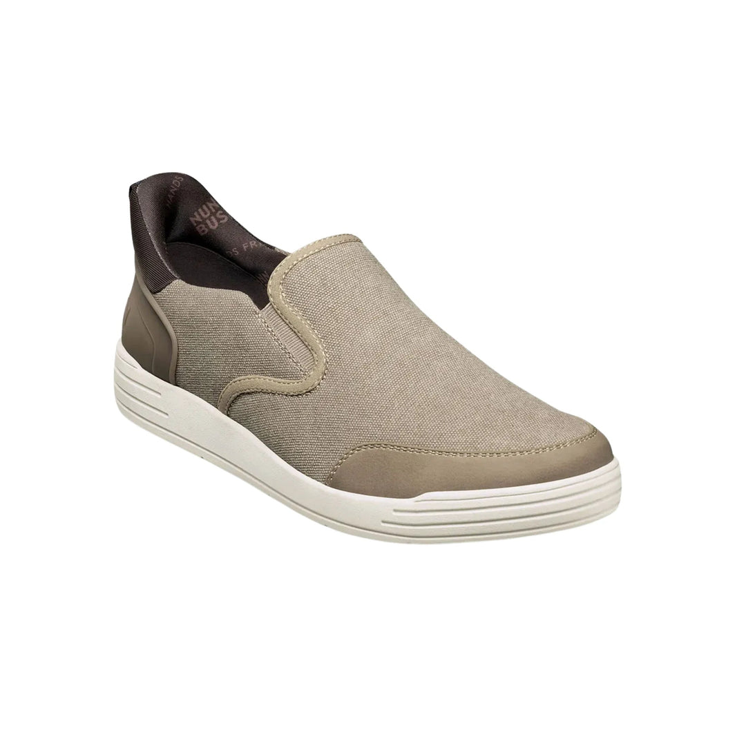 Beige slip-on canvas shoe with moc toe, white sole, and dark brown heel collar
