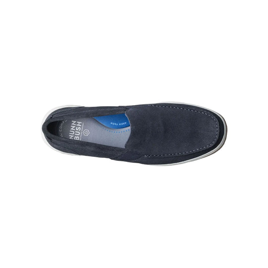 Navy slip-on loafer with moc toe stitching and white sole, viewed from above