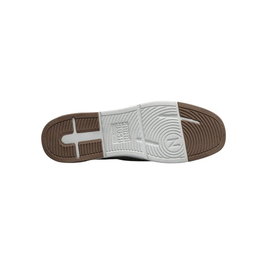 Brown and white shoe outsole with textured rubber tread and visible Nunn Bush branding