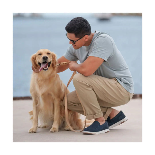 Navy suede slip-on shoes worn with rolled khaki pants