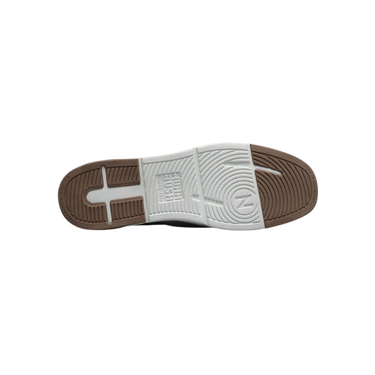Shoe outsole with brown rubber tread and white center section, showing Nunn Bush branding