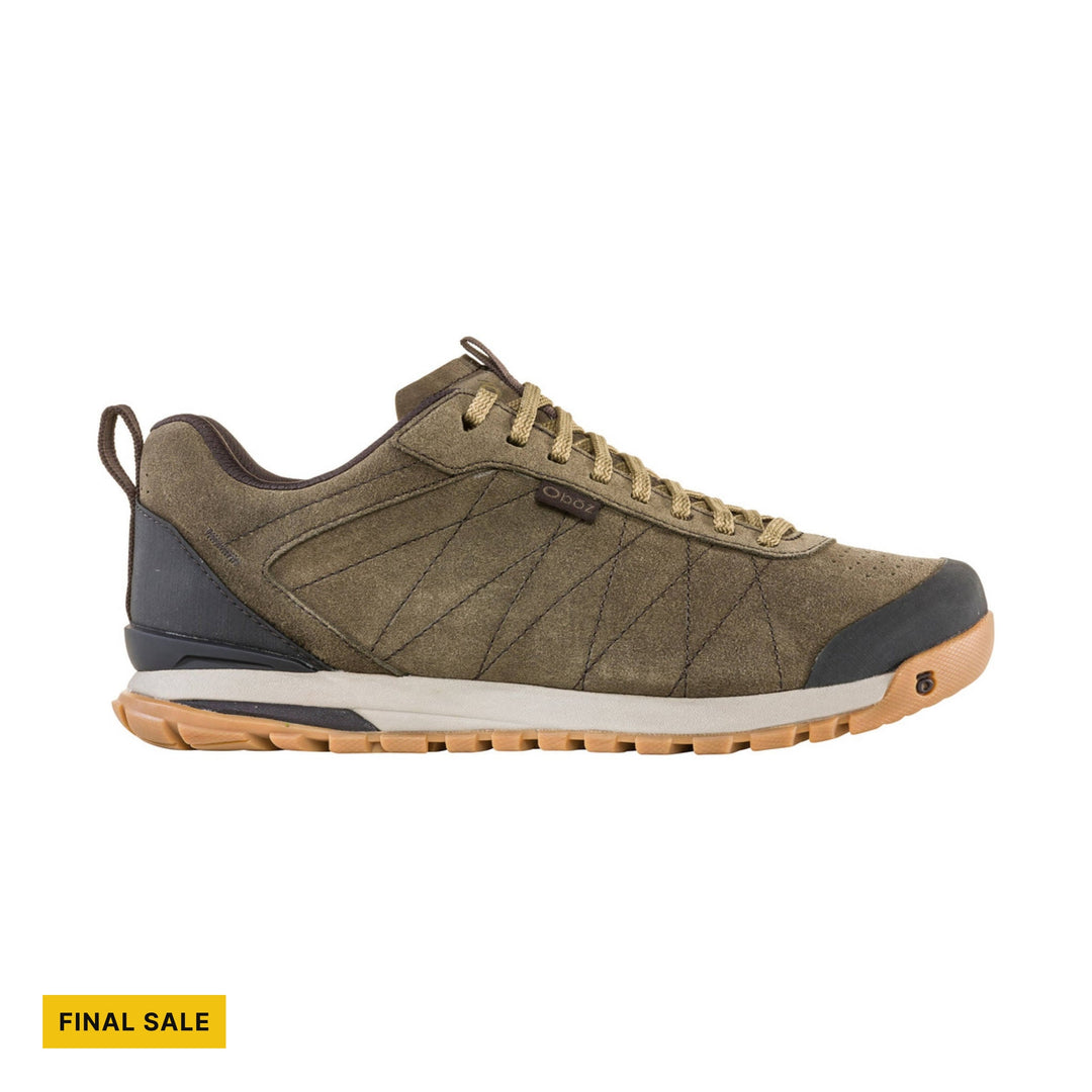 Olive low-top hiking shoe with tan laces, black toe cap, and FINAL SALE label