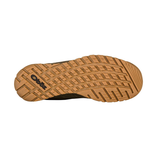 Tan hiking shoe outsole with deep tread and Oboz logo