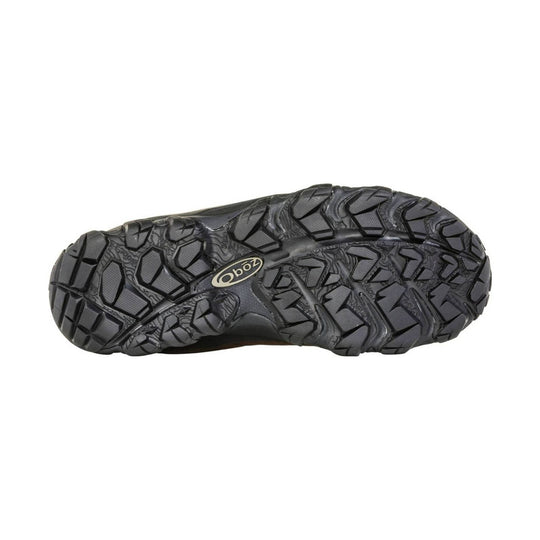 Black rugged boot outsole with deep lug tread and an Oboz logo at center