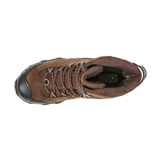 Top-down view of a brown leather hiking boot with black rubber toe cap and braided laces